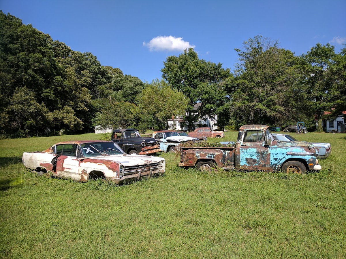 field of junk cars and junk trucks